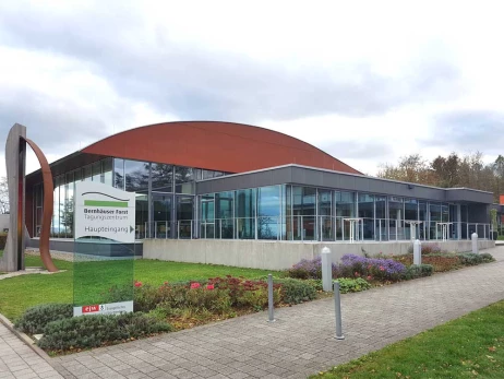 The image shows the entrance area of the event venue in the context of Fundraising Day Stuttgart on April 14, 2027. The congress brings together nonprofits and foundations to exchange practical know-how on donations, corporate partnerships, and fundraising best practices. The ISO-Gruppe attends with Charity:up, demonstrating personalized videos that let supporters donate or subscribe to newsletters directly within the video - without disruption.