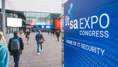 Entrance area of the it-sa Expo & Congress with the banner “Home of IT Security”