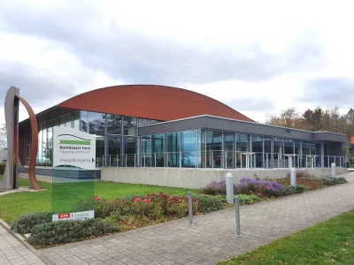 The image shows the entrance area of the event venue in the context of Fundraising Day Stuttgart on April 14, 2027. The congress brings together nonprofits and foundations to exchange practical know-how on donations, corporate partnerships, and fundraising best practices. The ISO-Gruppe attends with Charity:up, demonstrating personalized videos that let supporters donate or subscribe to newsletters directly within the video - without disruption.