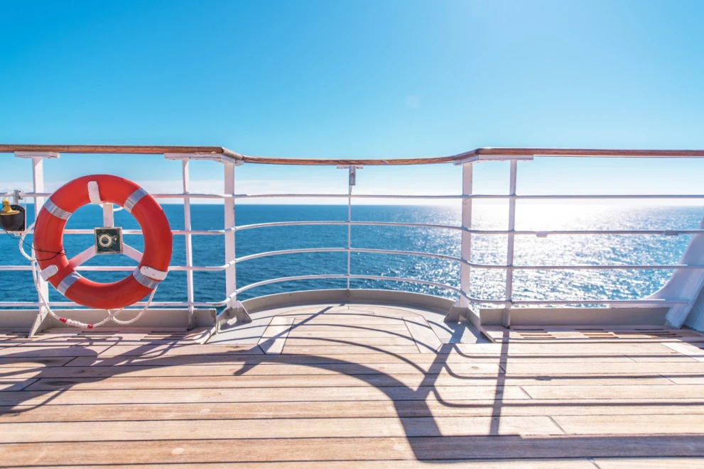 Cruise ship deck with lifebuoy and sea view representing a potential Yield:up use case for cruise companies.