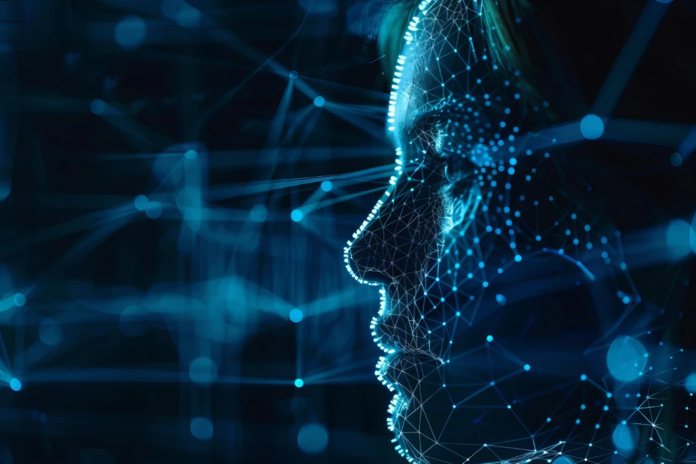 Digitale Seitenansicht eines Gesichts, bestehend aus vernetzten Punkten und Linien – visualisiert die Verschmelzung von menschlichem Denken und künstlicher Intelligenz.